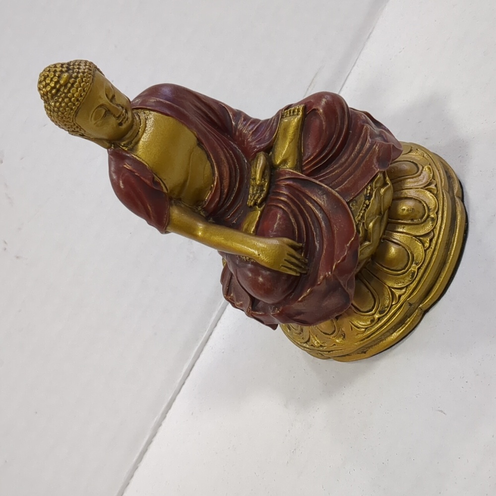 Buddha earth touching pose